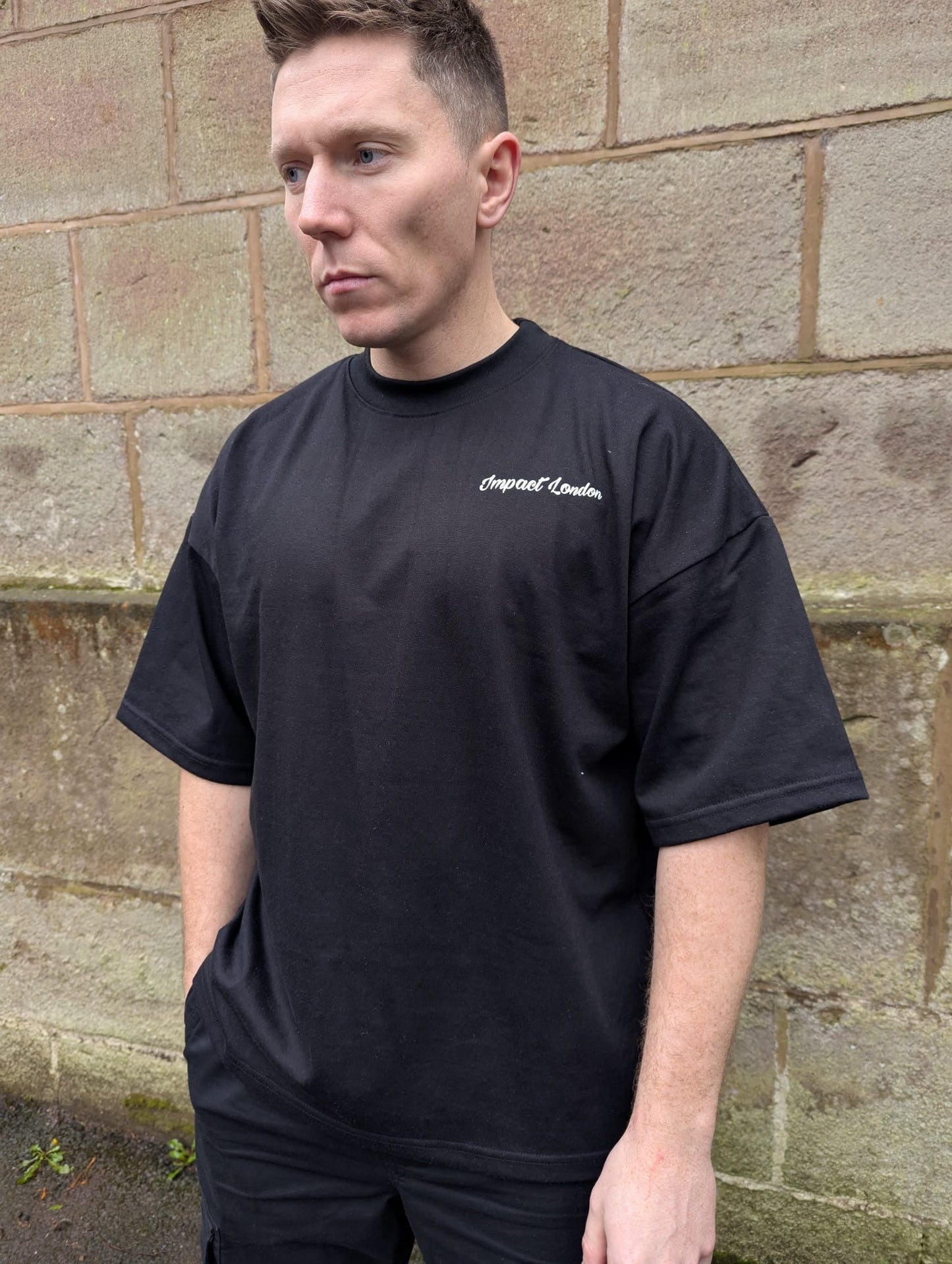 close up of white printed Impact London logo