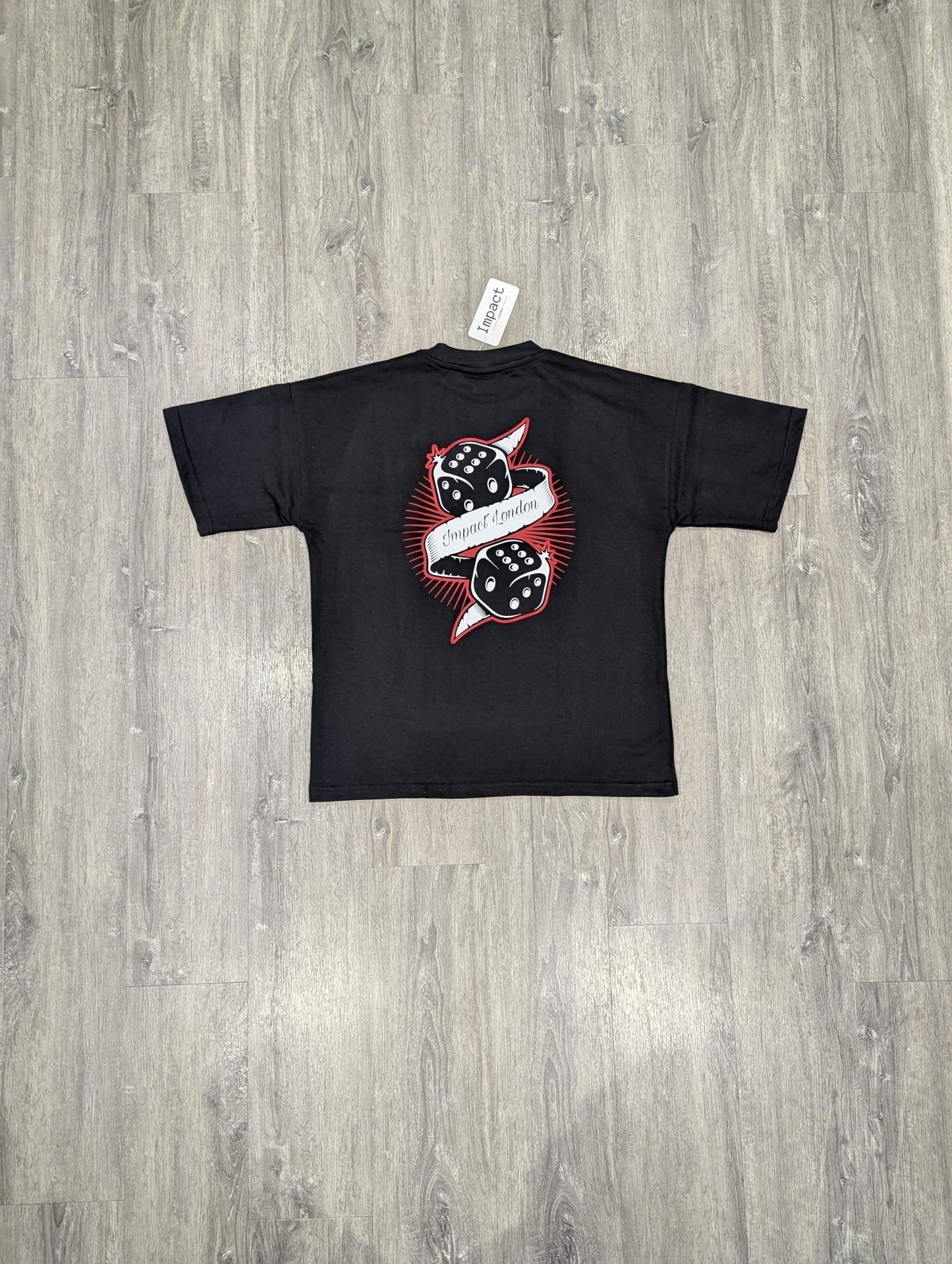 Unisex Oversized Black T-Shirt back view on the floor