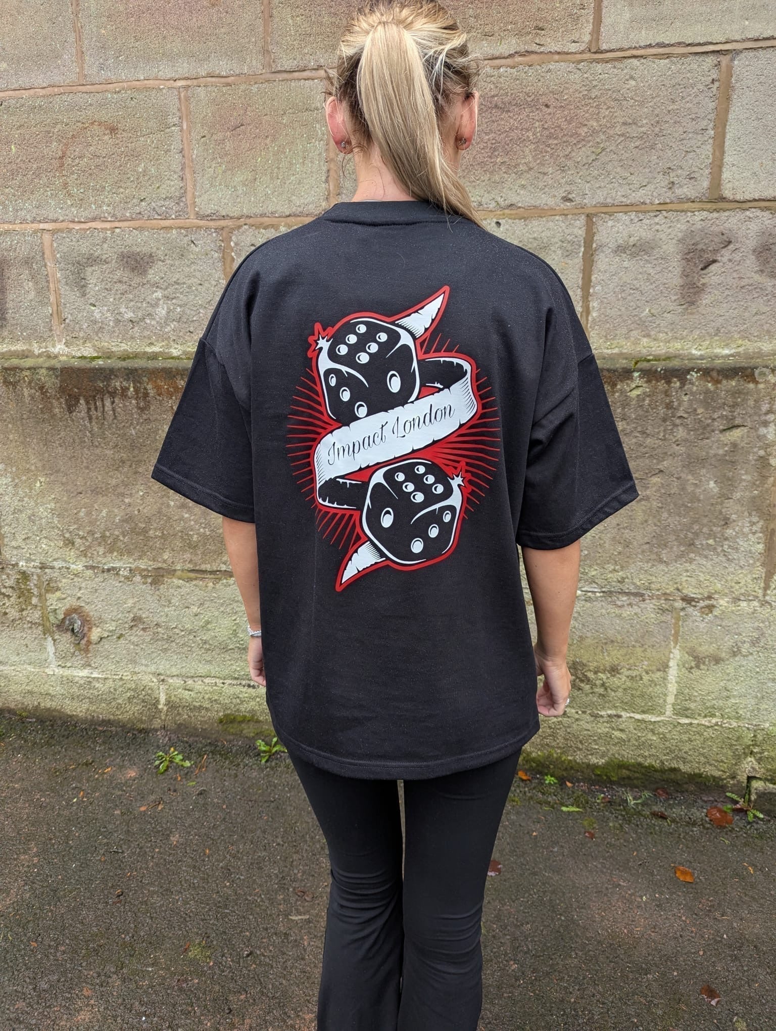 Black two dice printed logo to the back of the unisex black t-shirt