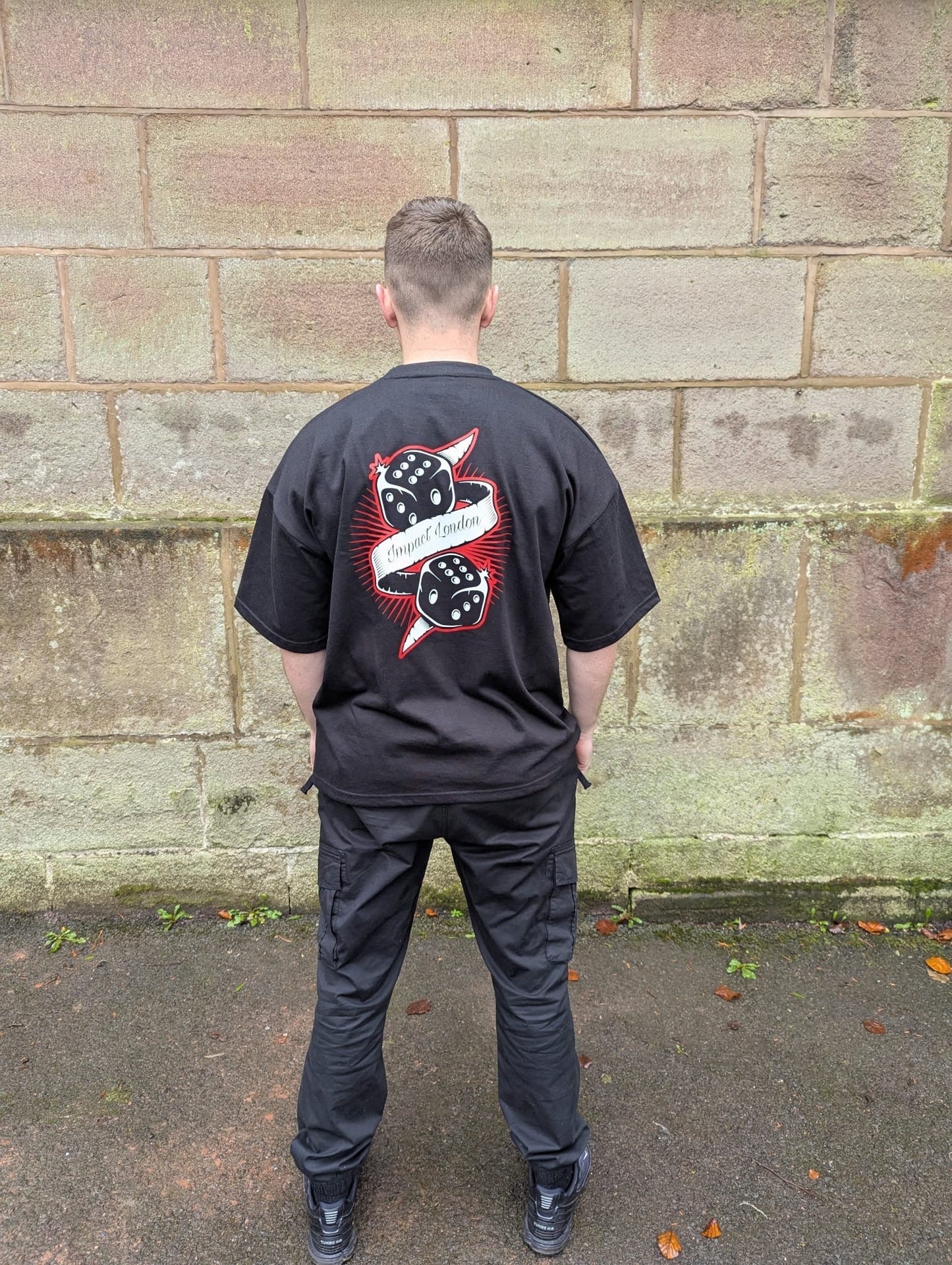 Unisex black oversized t-shirt with black diced logo printed on the back