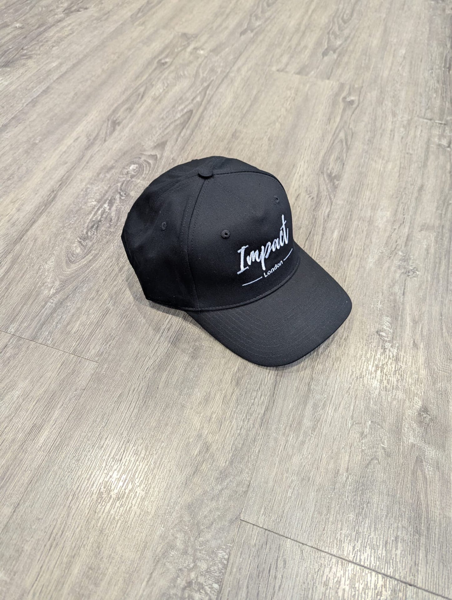 Black Strapback Cap with White Embroidery Logo