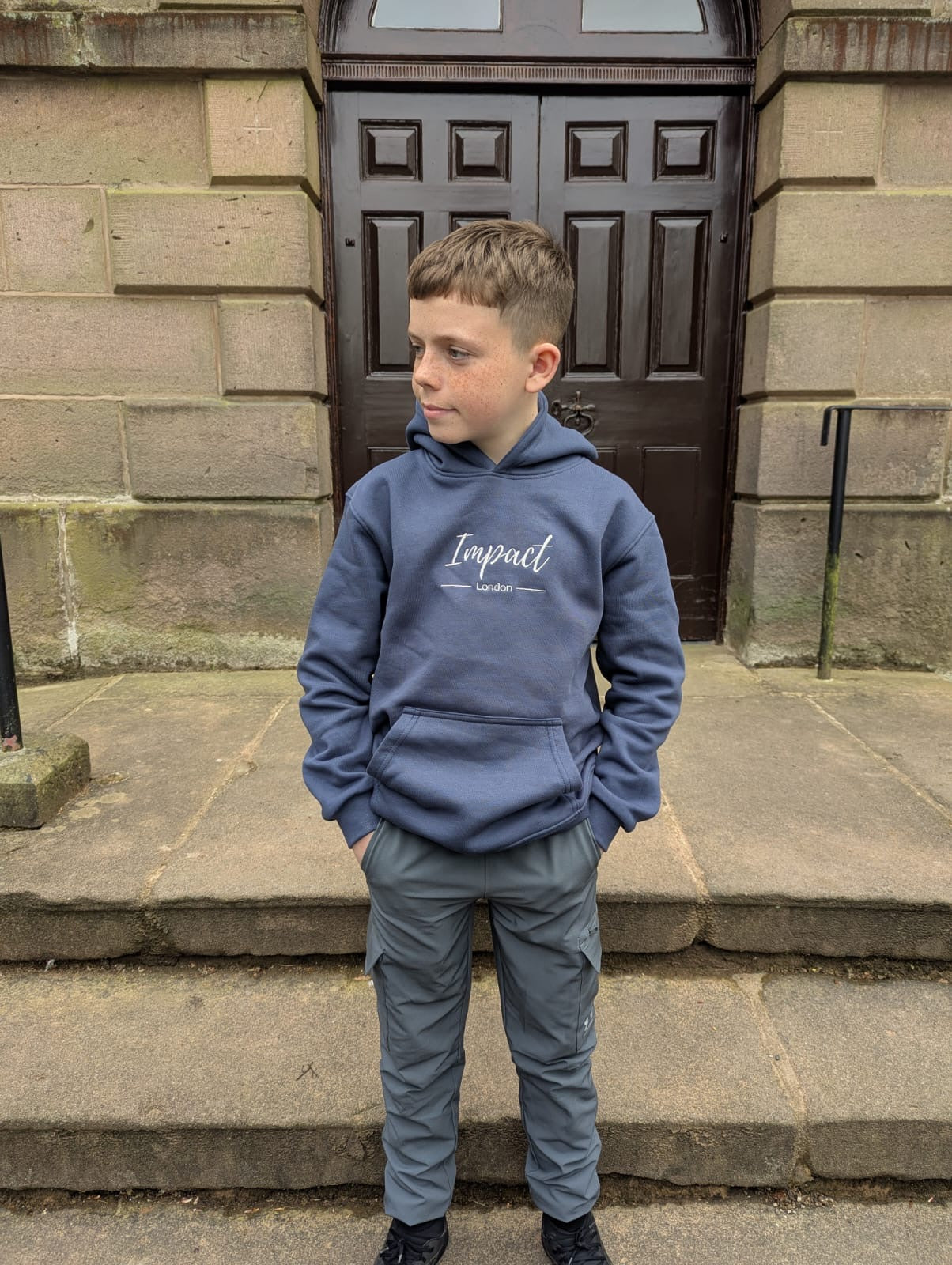 Children's navy blue hoodie with grey Impact London logo