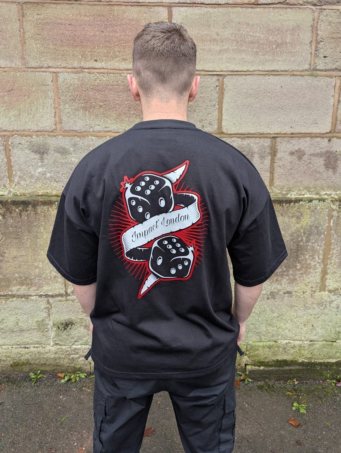 Close up of Unisex black oversized t-shirt with black diced logo printed on the back