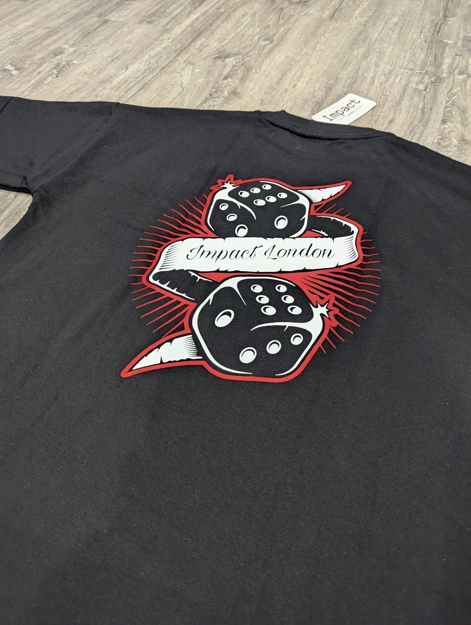 Unisex Oversized Black T-Shirt close up of the printed dice