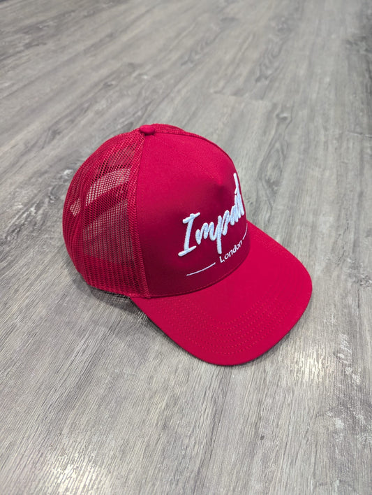 Red trucker cap with white logo from Impact London