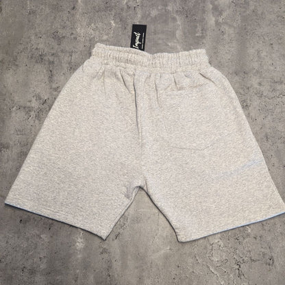 The back of the grey Impact London men's jogger shorts laid on a light grey wooden flooring