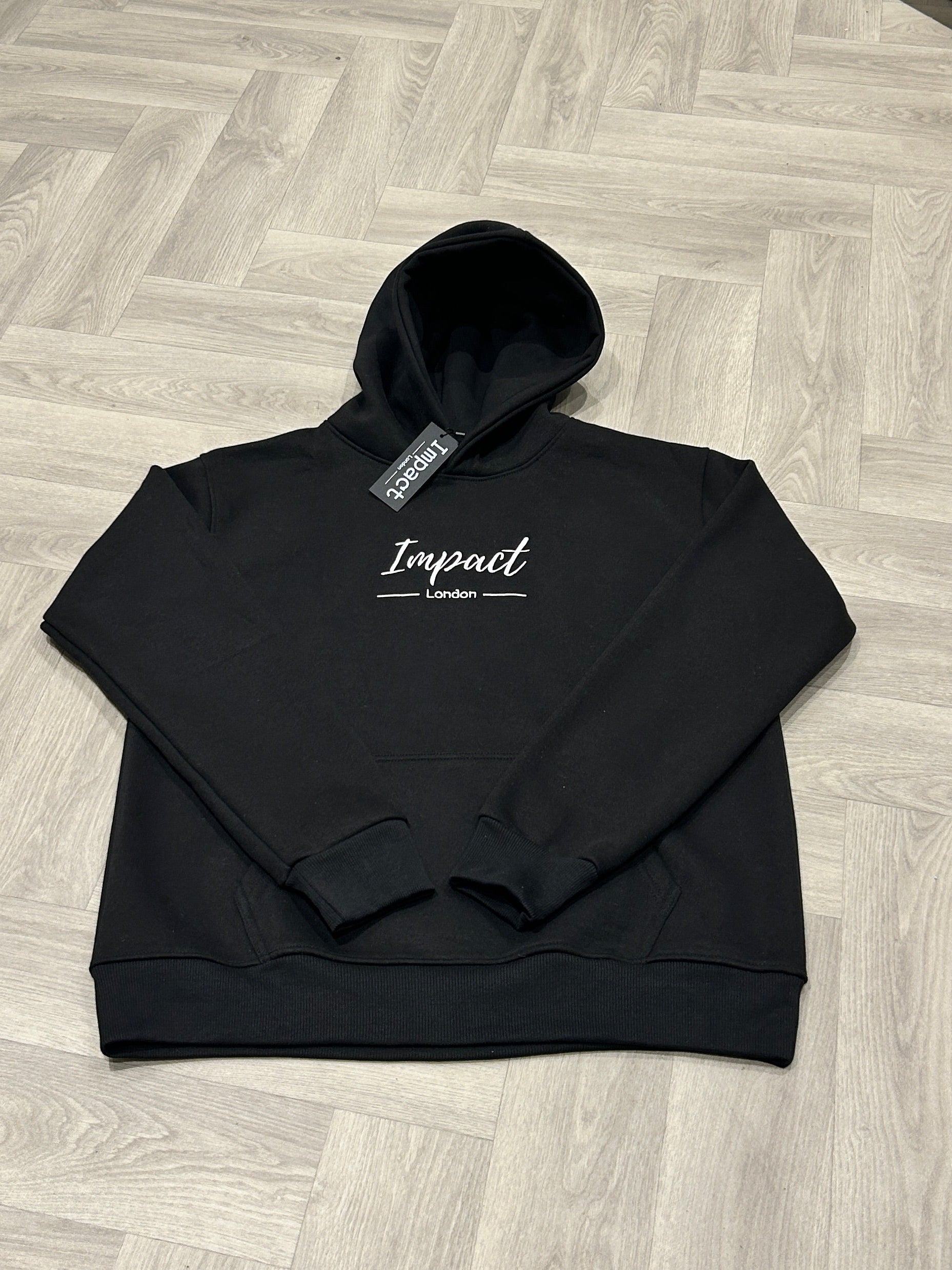 Impact London black hoodie with white embroidered logo front view